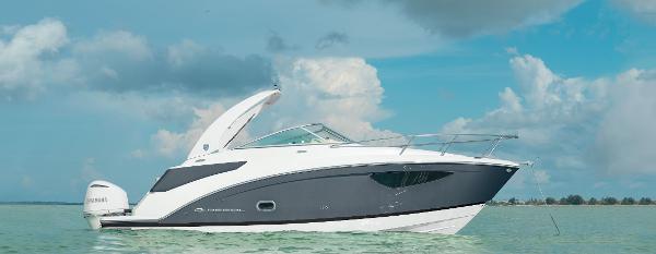 Regal 26 XO 2025 Regal 26 XO boat on calm water under a cloudy sky.