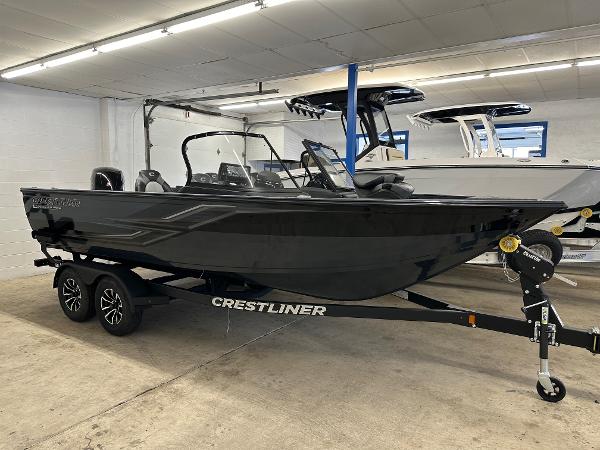 Crestliner 1950 Super Hawk 2025 Crestliner 1950 Super Hawk boat in showroom, black exterior, on trailer.