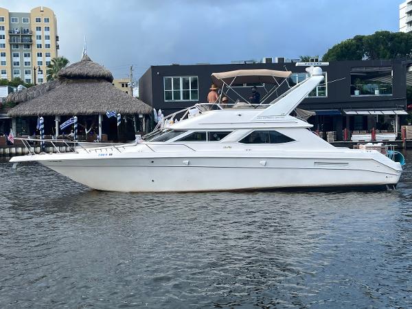 Sea Ray 440 Express Bridge 1998 Sea Ray 440 Express Bridge yacht docked near waterfront buildings.