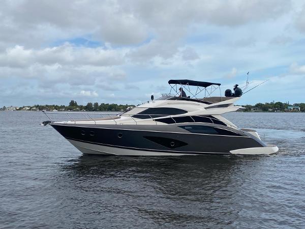 Marquis 500 Sport Yacht 2017 Marquis 500 Sport Yacht cruising on a calm waterway.