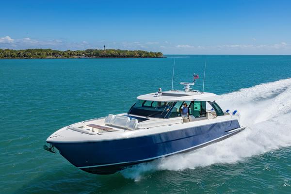 Tiara Yachts 56 LS 2025 Tiara Yachts 56 LS cruising on clear blue water under a sunny sky.