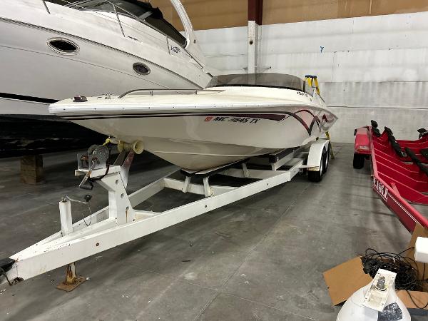 Fountain 24 Competition 1995 Fountain 24 Competition boat on trailer in storage facility.