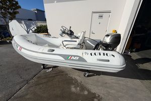 AB Inflatables 10VST 2013 AB Inflatables 10VST boat with Honda outboard motor on a sunny day.