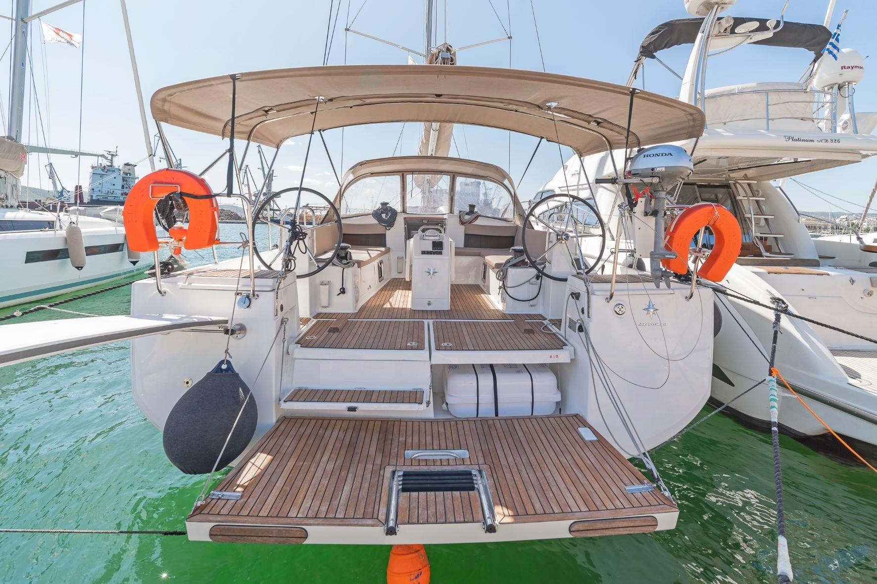 Jeanneau Sun Odyssey 490 2020 Jeanneau Sun Odyssey 490 yacht with spacious deck and dual steering wheels.