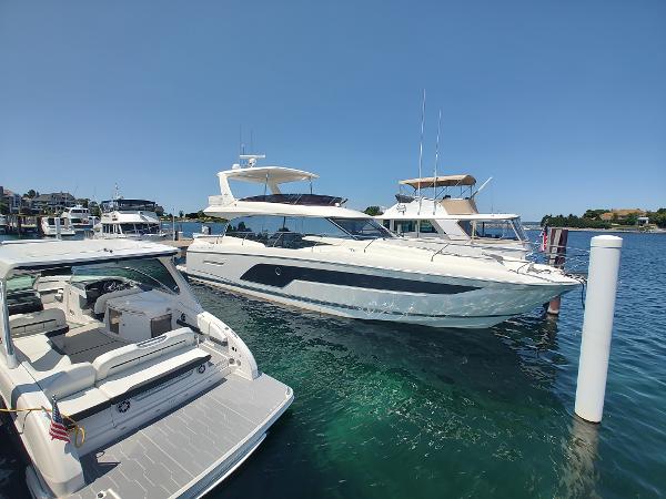 Prestige 590 Luxury 2020 Prestige 590 yacht docked in a sunny marina.