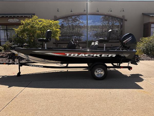 Tracker Pro Team 175 2025 Tracker Pro Team 175 boat on trailer, parked outdoors.