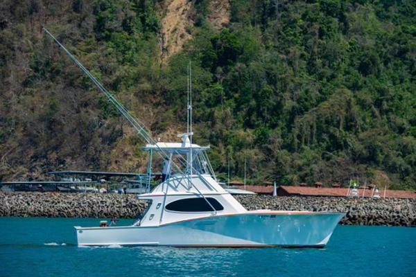 Maverick Yachts Costa Rica 42 Flybridge 2006 Maverick Yachts Costa Rica 42 Flybridge cruising on blue waters near lush coastline.