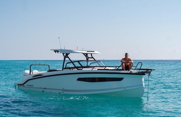 Navan S30 2025 Navan S30 boat on clear blue water with a person seated on deck.