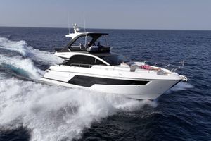 Fairline Squadron 58 2025 Fairline Squadron 58 yacht cruising on open sea, showcasing sleek design and luxury.