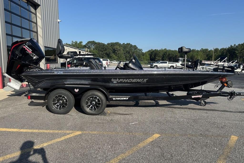 Phoenix 721 ZXL 2026 Phoenix 721 ZXL boat on trailer, parked outdoors near a building.