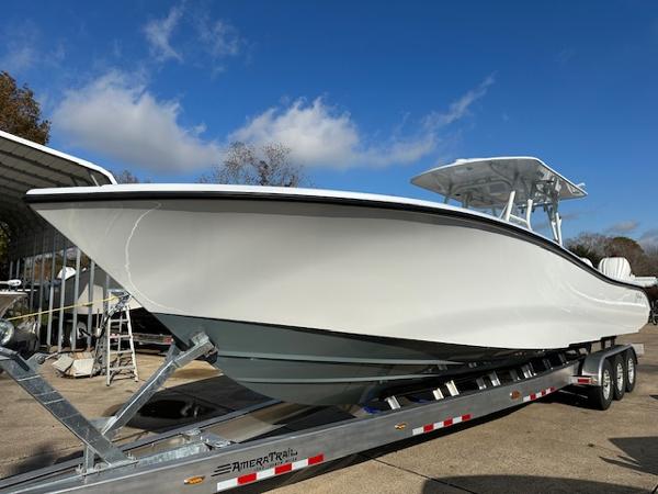 Yellowfin 36 Offshore 2024 Yellowfin 36 Offshore boat on trailer under clear blue sky.