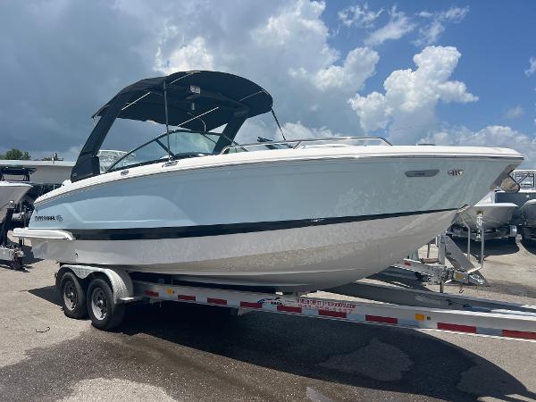 Chaparral 270 OSX 2024 Chaparral 270 OSX boat on a trailer under a cloudy sky.