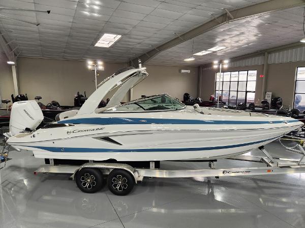 Crownline 270 XSS 2024 Crownline 270 XSS boat on trailer in showroom.