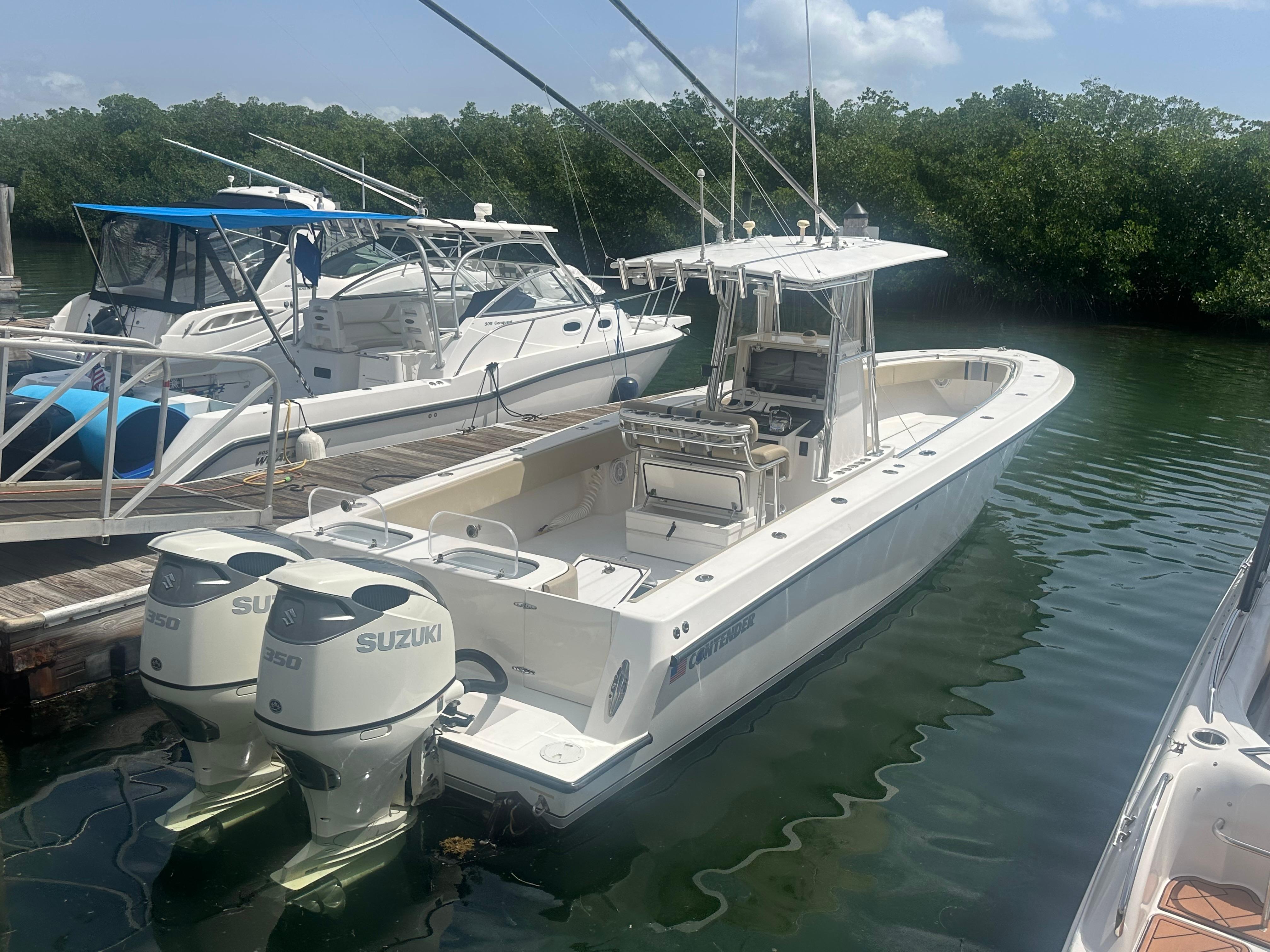 Contender 36 Open 2008 Contender 36 Open boat docked with dual Suzuki engines.