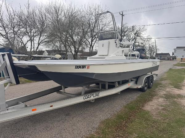 Catalyst 260 Catamaran 2019 Catalyst 260 Catamaran on trailer, parked on a residential street.