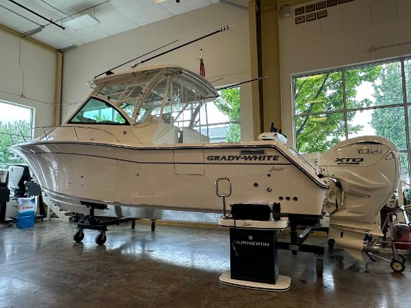 Grady-White Express 330 2025 Grady-White Express 330 boat in showroom, featuring Yamaha XTO engines.