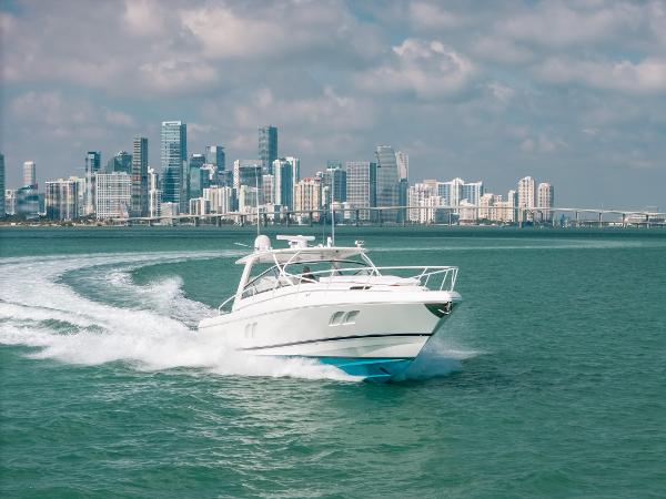 Intrepid 475 Sport Yacht 2009 Intrepid 475 Sport Yacht cruising near a city skyline on a sunny day.