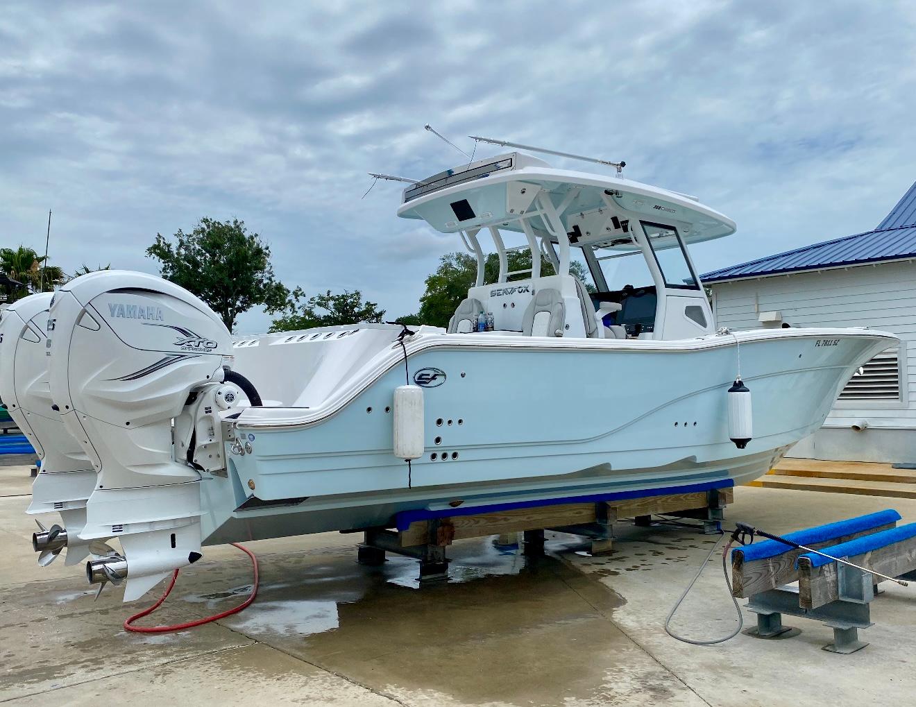 Sea Fox 368 Commander 2021 Sea Fox 368 Commander boat with twin Yamaha engines on a dock.