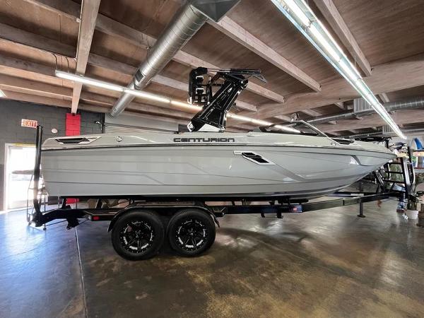 Centurion Ri245 2023 Centurion Ri245 boat on trailer in showroom, side view.