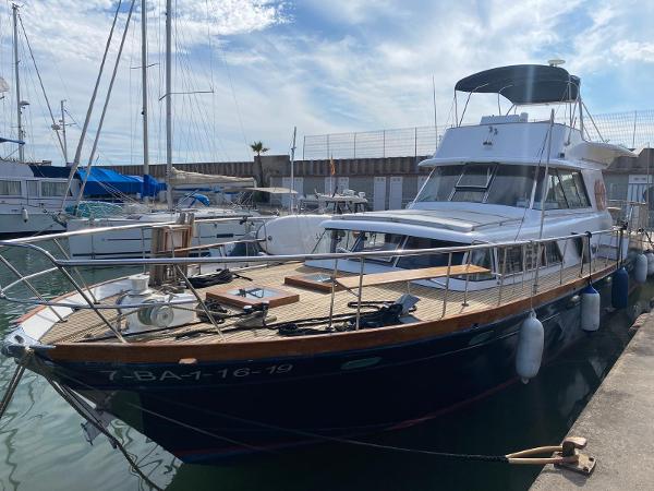 Picchiotti Giannutri 1963 Picchiotti Giannutri yacht docked at marina under blue sky.