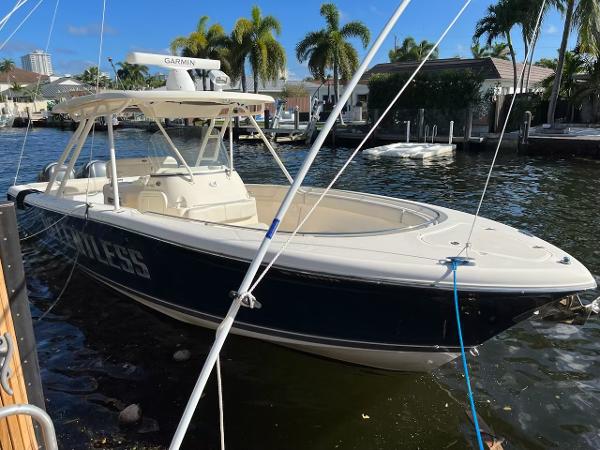 Pursuit S 310 Sport 2009 Pursuit S 310 Sport boat docked in a sunny marina.