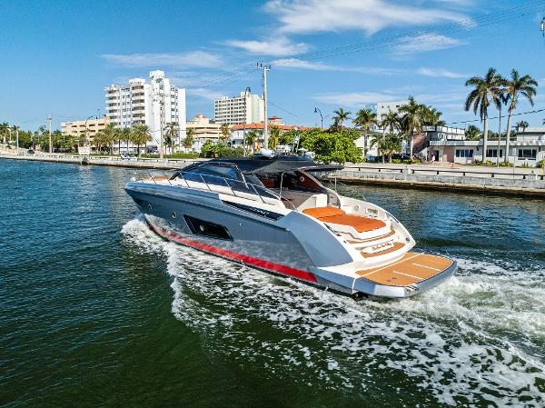 Azimut Atlantis 48 Azimut Atlantis 48 yacht cruising near a city waterfront, 2013 model.