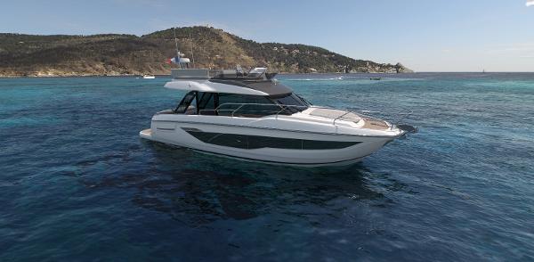 Prestige F4.3 2026 Prestige F4.3 yacht cruising in clear blue waters near a scenic coastline.