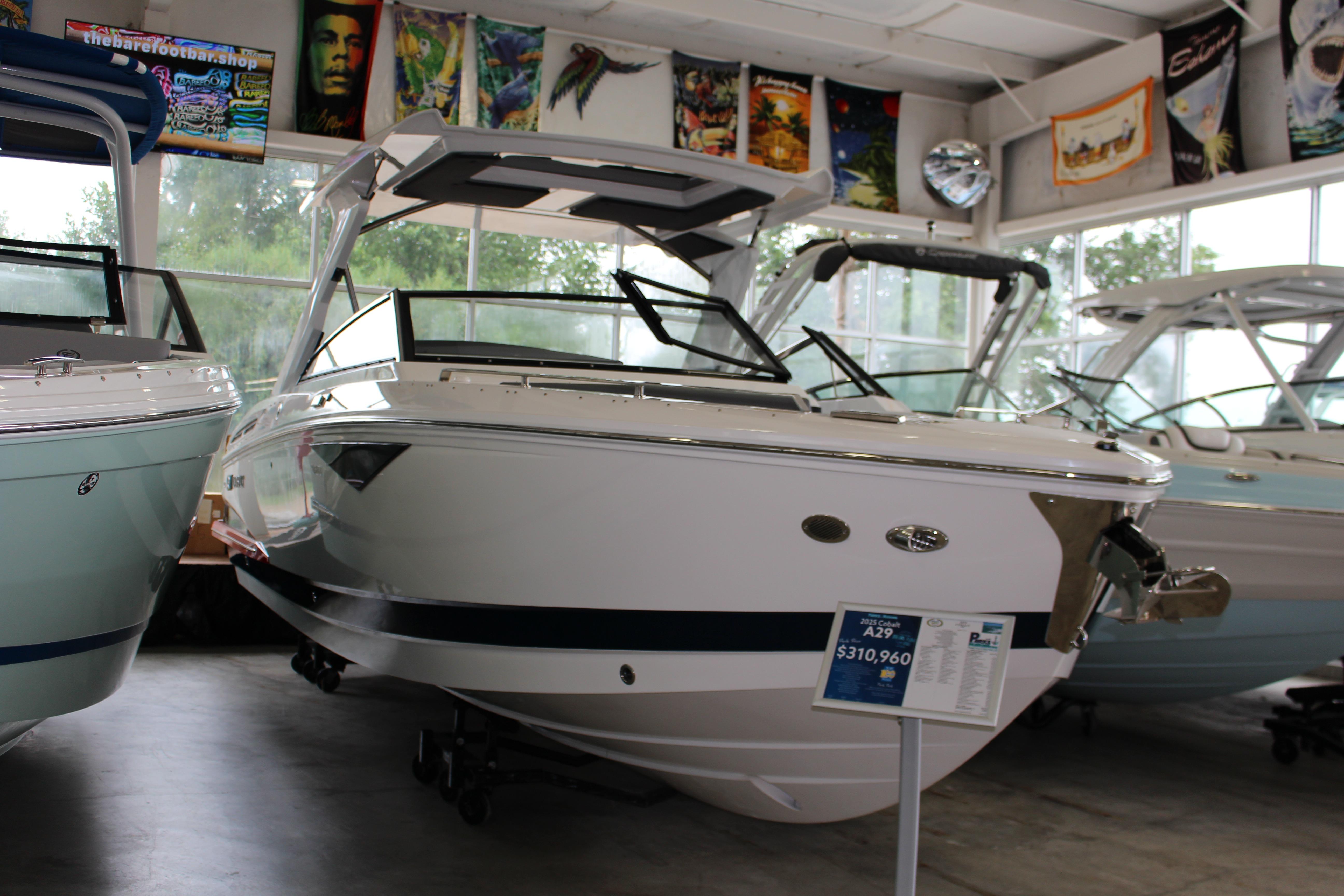 Cobalt A29 2025 Cobalt A29 boat displayed in showroom with price tag.