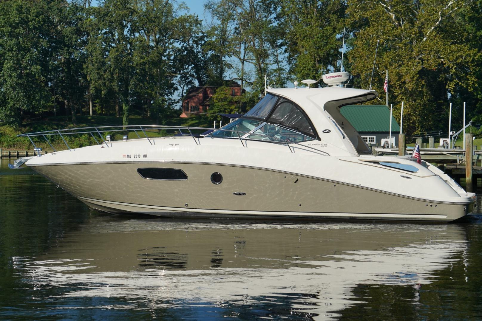 Sea Ray 370 Sundancer 2010 Sea Ray 370 Sundancer yacht docked on calm water, surrounded by trees.