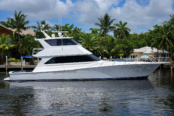 Viking 65 Enclosed Bridge 2001 Viking 65 Enclosed Bridge yacht on a tropical waterway.