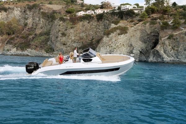 Ranieri NEXT 330 XL 2025 Ranieri NEXT 330 XL boat cruising near rocky coastline.
