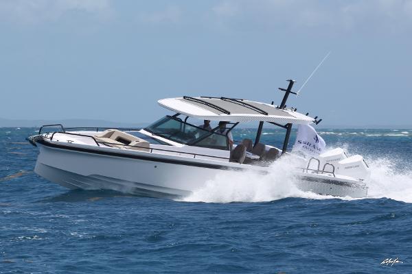 Axopar 37 Sun Top Brabus Performance 2025 Axopar 37 Sun Top Brabus Performance cruising on open water.