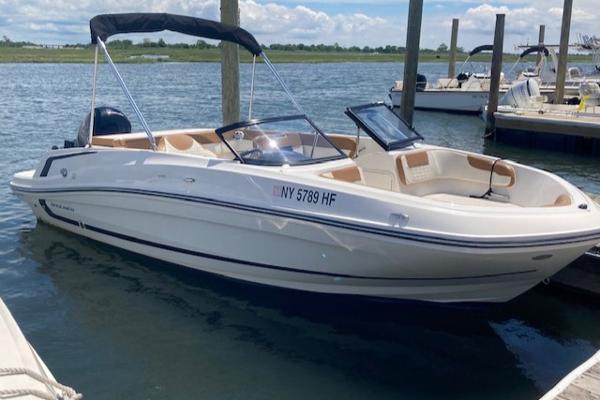 Bayliner VR5 2021 Bayliner VR5 boat docked in a marina on a sunny day.
