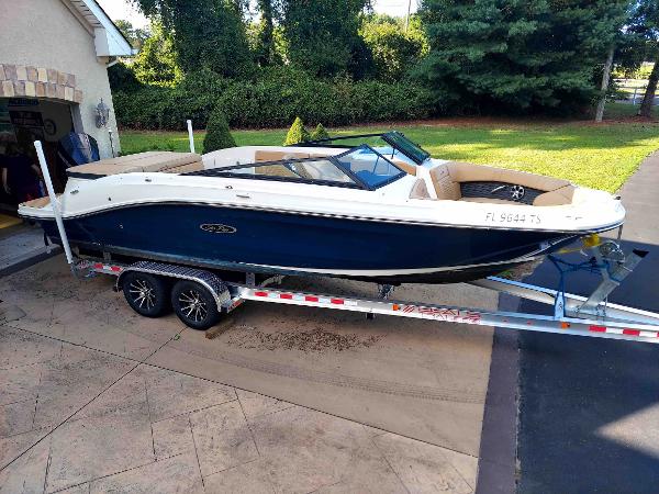 Sea Ray SPX 230 Outboard 2021 Sea Ray SPX 230 OB boat on trailer, parked in driveway.