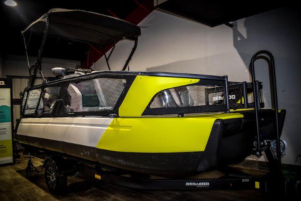 Sea-Doo Switch Sport 21 2022 Sea-Doo Switch Sport 21, yellow and black, on trailer in indoor setting.