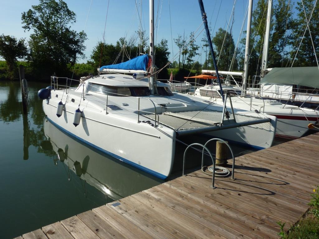 Fountaine Pajot Tobago 35 Sailing catamaran "Tobago 35" docked, 1996 model, calm water, sunny day.