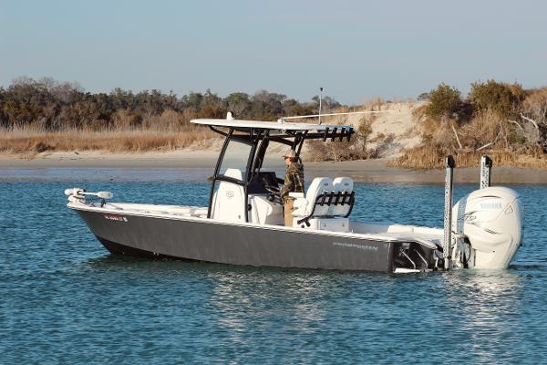 Sportsman Masters 267 Bay Boat 2021 Sportsman Masters 267 Bay Boat on calm water near a sandy shore.