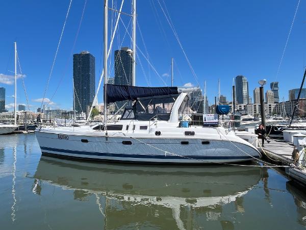 Hunter Passage 450 Sailboat docked in marina, 1999 Hunter Passage 450, with city skyline in background.