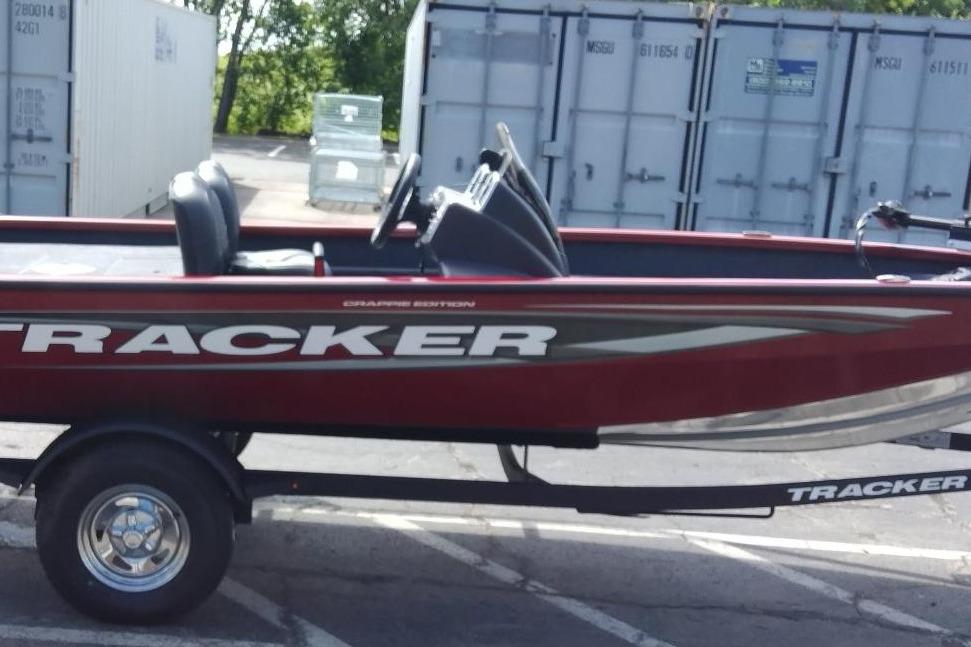 Tracker Pro Team 175 Crappie Edition 2025 Tracker Pro Team 175 Crappie Edition boat on trailer, parked outdoors.