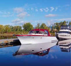 Custom Michel dufresne 42 Custom Michel Dufresne 42 boat, 2020 model, docked on calm water under blue sky.