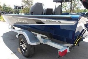 Lowe Stinger 175C 2024 Lowe Stinger 175C boat on trailer, blue exterior, rear view.