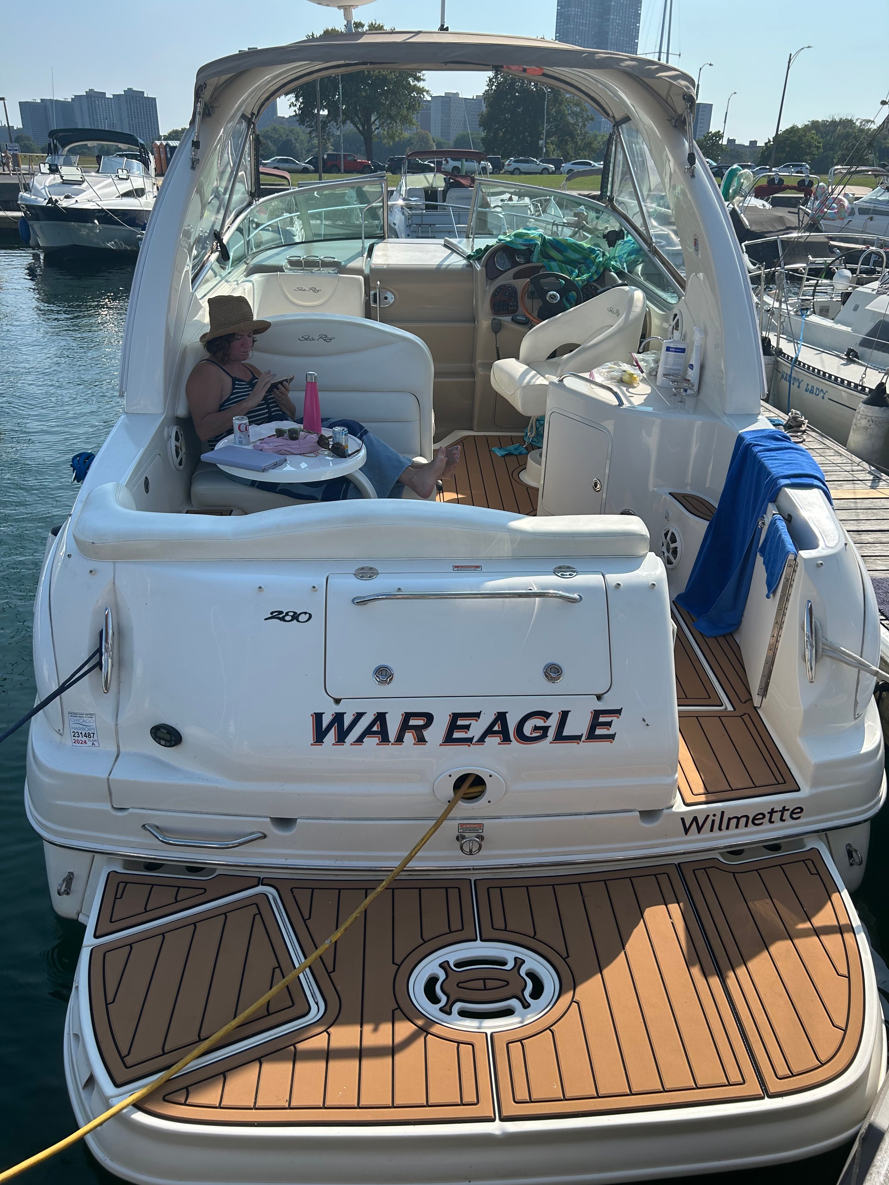Sea Ray 280 Sundancer 2005 Sea Ray 280 Sundancer boat docked, featuring "War Eagle" name and teak deck.