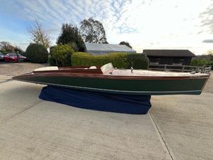 Andrews 30 Vintage 1935 Andrews 30 boat displayed outdoors on a blue cover.