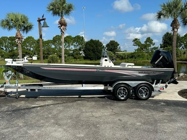 Ranger RB210 2024 Ranger RB210 boat on trailer, parked outdoors under clear sky.