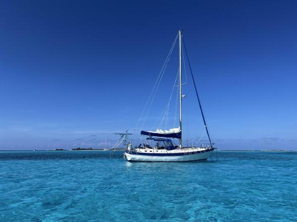 Catalina Classic 41 Catalina Classic 41 sailboat from 1987 on clear blue ocean under a bright sky.