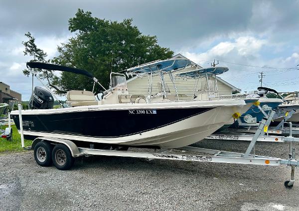 Carolina Skiff 21 Ultra Elite 2022 Carolina Skiff 21 Ultra Elite boat on trailer, parked outdoors.