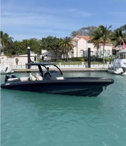 Skipper-BSK 38 2024 Skipper-BSK 38 boat in a tropical marina with palm trees and clear water.