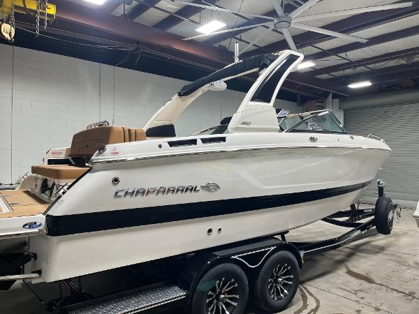 Chaparral 267 SSX 2025 Chaparral 267 SSX boat in a showroom, on a trailer.