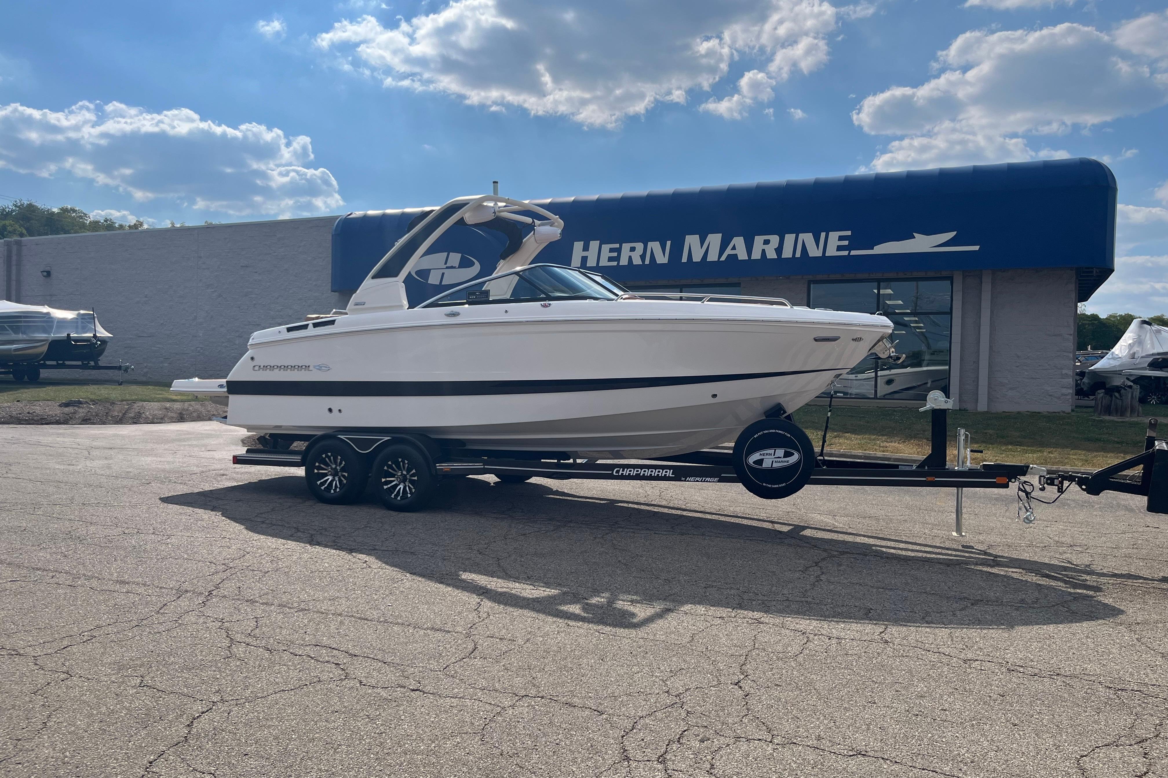 Chaparral 267 SSX 2025 Chaparral 267 SSX boat on trailer at Hern Marine dealership.