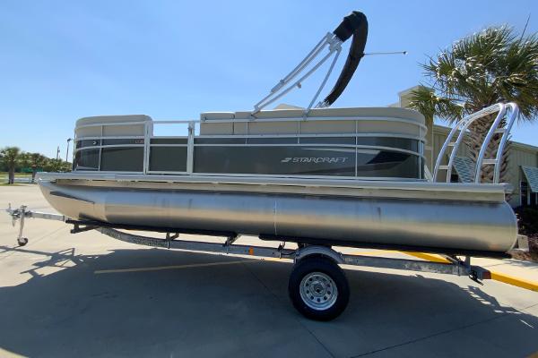 Starcraft LX20 R 2024 Starcraft LX20 R pontoon boat on trailer, side view.